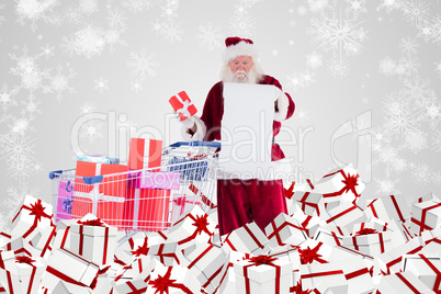 Composite image of santa delivering gifts from cart