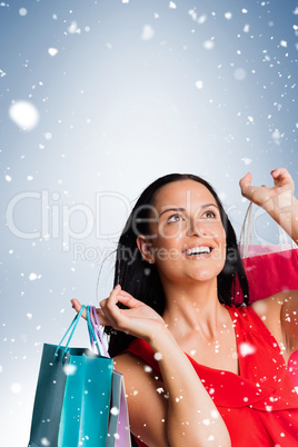 Woman standing with shopping bags