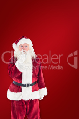 Composite image of santa asking for quiet to camera