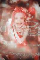 Composite image of festive little girl in hat and scarf