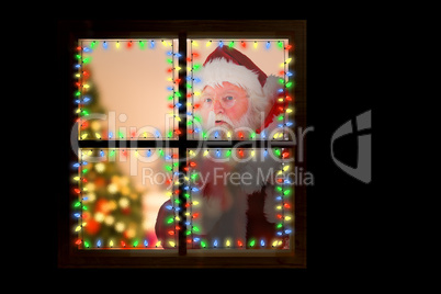 Composite image of santa claus carrying sack