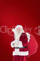 Composite image of santa carries his red bag