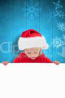 Composite image of festive little girl showing poster