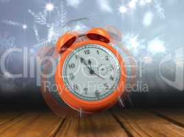 Composite image of alarm clock counting down to twelve