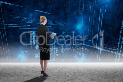 Composite image of businesswoman holding new tablet