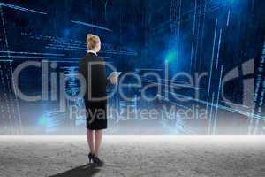 Composite image of businesswoman holding new tablet