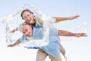 Composite image of happy casual couple having fun
