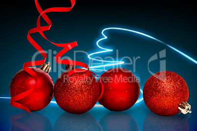 Composite image of four red christmas ball decorations