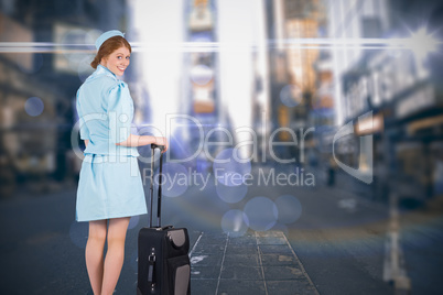 Composite image of pretty air hostess leaning on suitcase