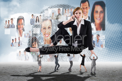 Composite image of business people supporting boss