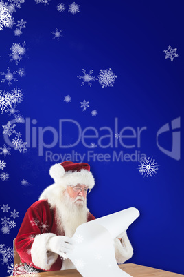 Composite image of santa reads a long list