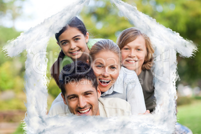 Composite image of happy family in the park