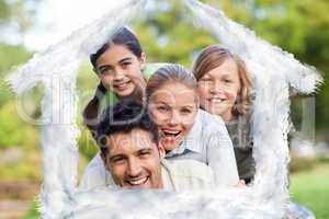 Composite image of happy family in the park
