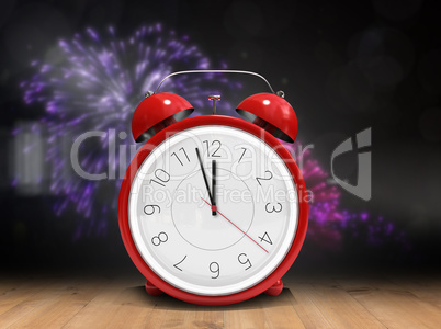 Composite image of alarm clock counting down to twelve