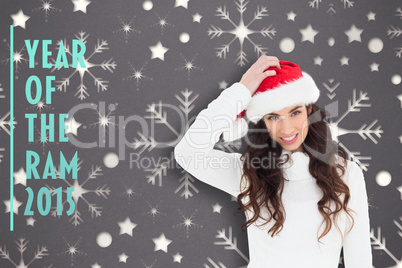 Composite image of confused brunette in santa hat