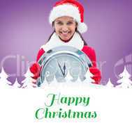 Composite image of festive brunette holding clock