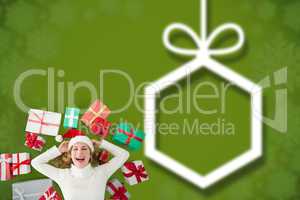 Composite image of woman laying on the floor with gifts around h