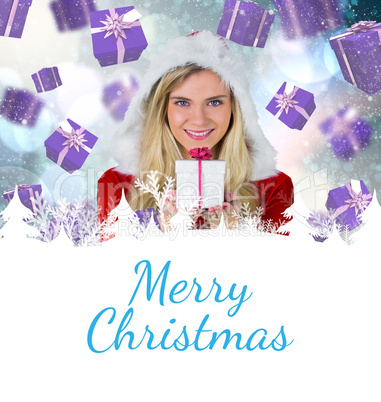 Composite image of pretty girl in santa outfit holding gift