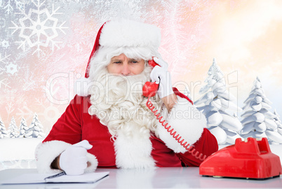 Composite image of santa on the phone