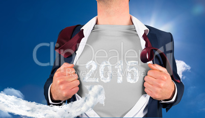 Composite image of businessman opening shirt in superhero style