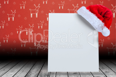 Composite image of santa hat on poster