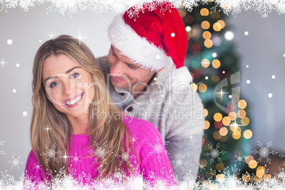 Composite image of smiling man wearing santa hat Composite image of smiling man wearing santa hat