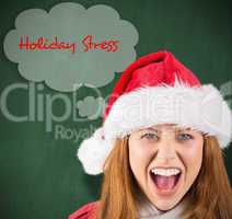 Composite image of festive redhead shouting at camera