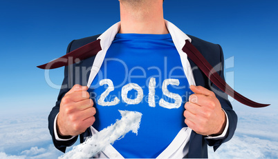 Composite image of businessman opening his shirt superhero style