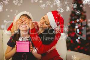 Composite image of mother surprising her daughter with christmas