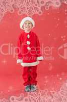 Composite image of cute little boy in santa costume