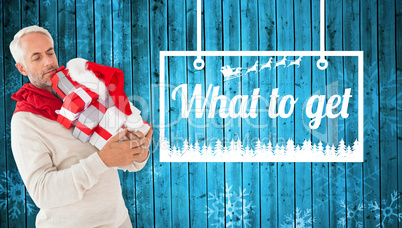 Composite image of happy festive man with gifts