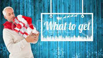 Composite image of happy festive man with gifts