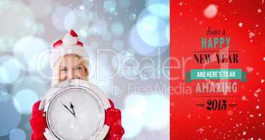 Composite image of happy festive blonde with clock