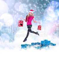 Composite image of festive blonde carrying gift bags