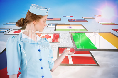 Composite image of pretty air hostess presenting with hand