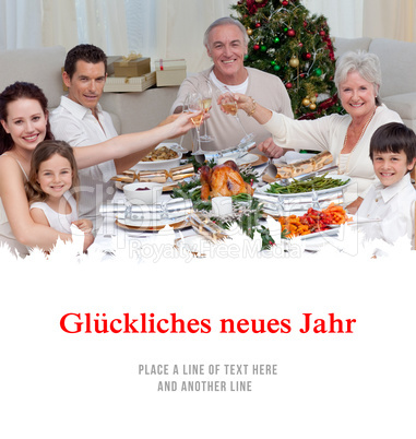 Composite image of family drinking a toast in a christmas dinner