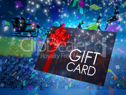 Composite image of santa flying his sleigh behind gift card