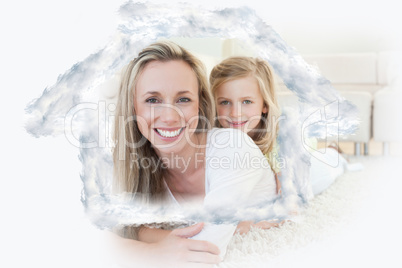 Composite image of mother and daughter lying on the floor