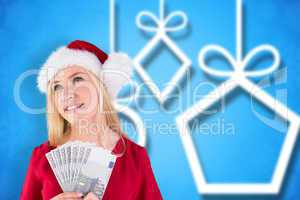 Composite image of festive blonde in red dress holding her cash