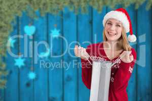 Composite image of woman holding shopping bag