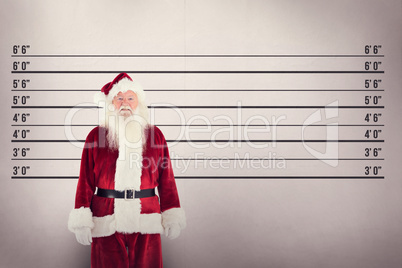 Composite image of jolly santa smiling at camera