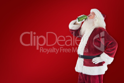 Composite image of father christmas drinks beer with closed eyes