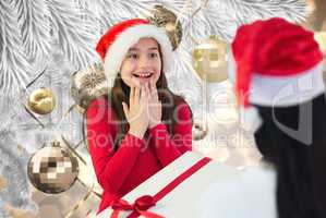 Composite image of little girl getting gift