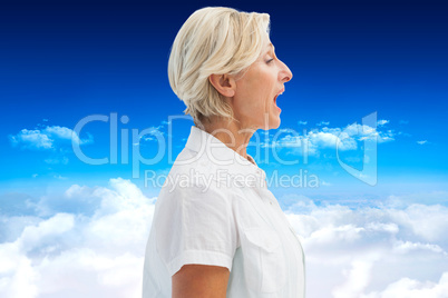 Composite image of happy mature woman talking loudly