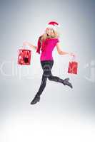 Festive blonde carrying gift bags