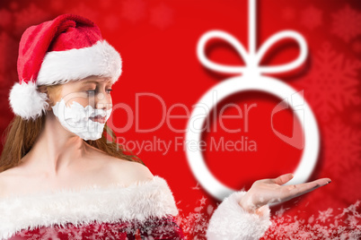 Composite image of festive redhead in foam beard