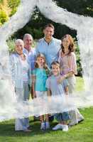 Composite image of smiling family and grandparents in the park