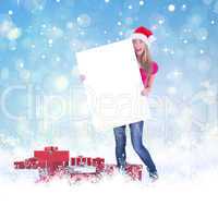 Festive blonde holding large poster