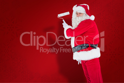 Composite image of happy santa claus painting