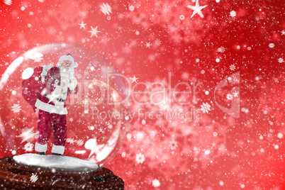 Composite image of santa asking for quiet in snow globe